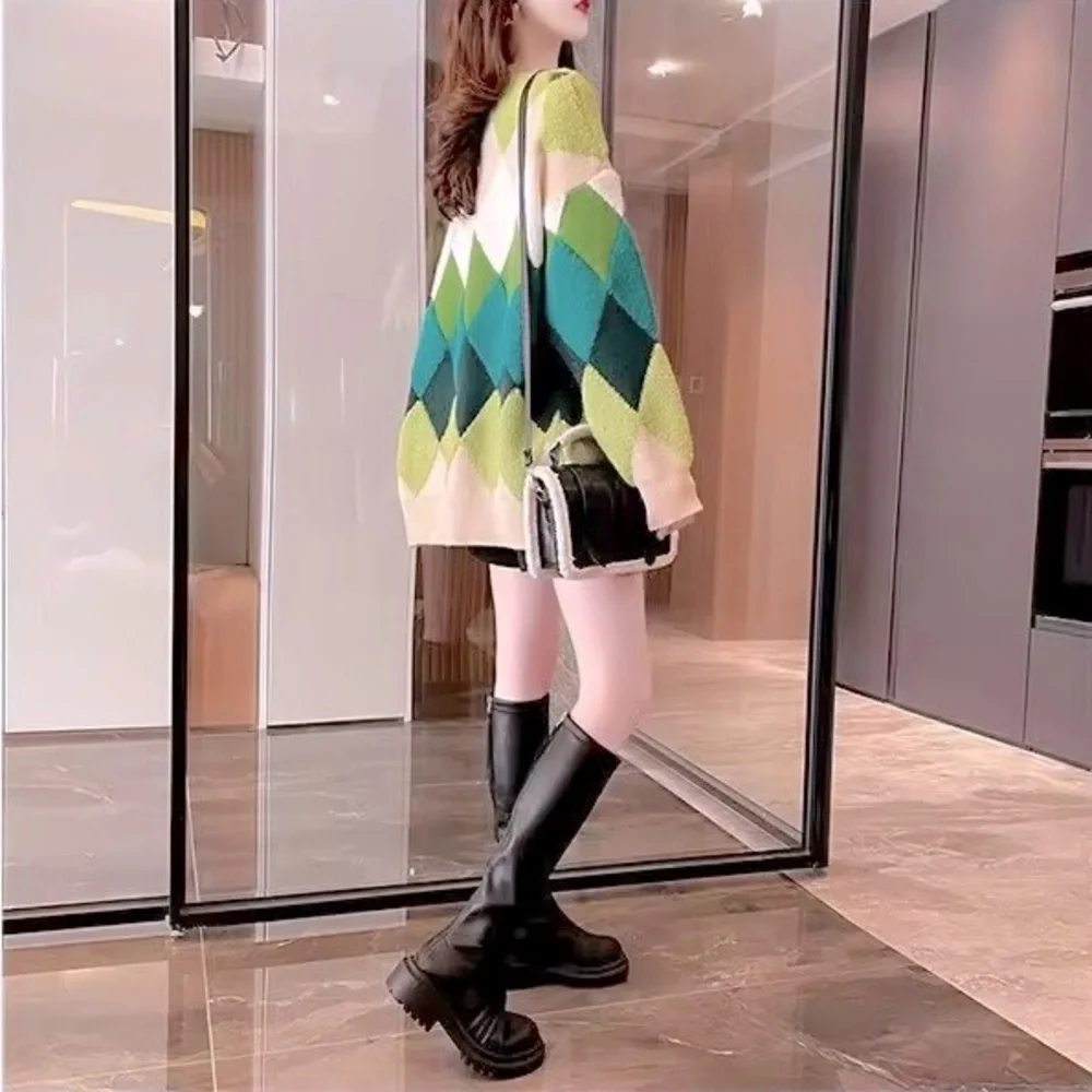 Green and cream harlequin patterned button up sweater